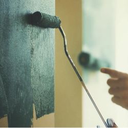 How To Use A Paint Roller - Dipping The Paint Roller